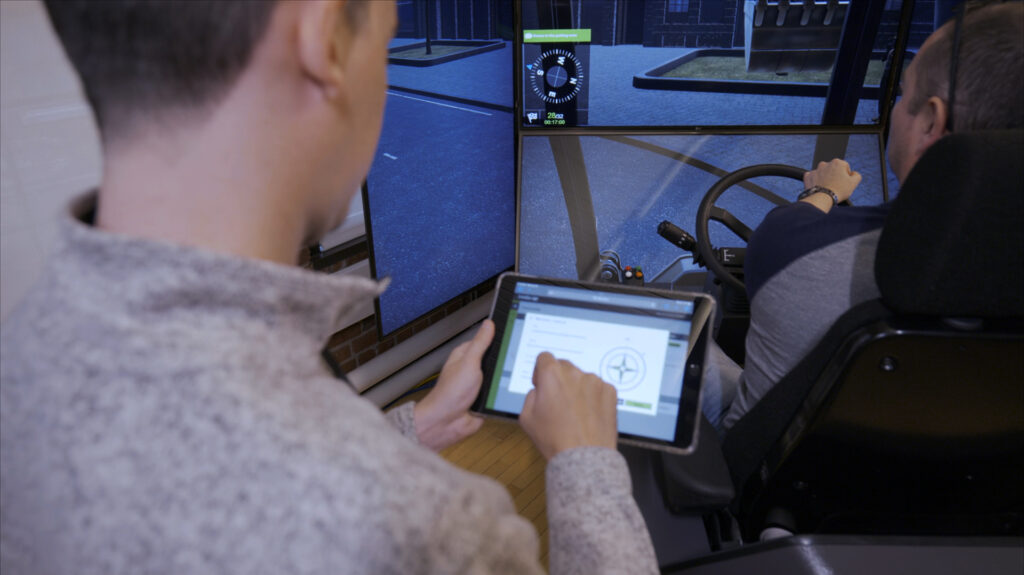 Intellia Instructor on tablet with Heavy Equipment Instructor and operator training